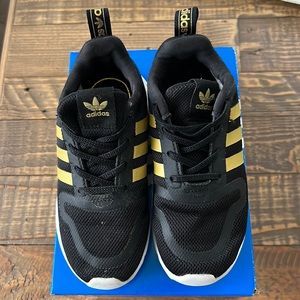 Adidas Multix EL I size 9 toddler black and gold sneakers